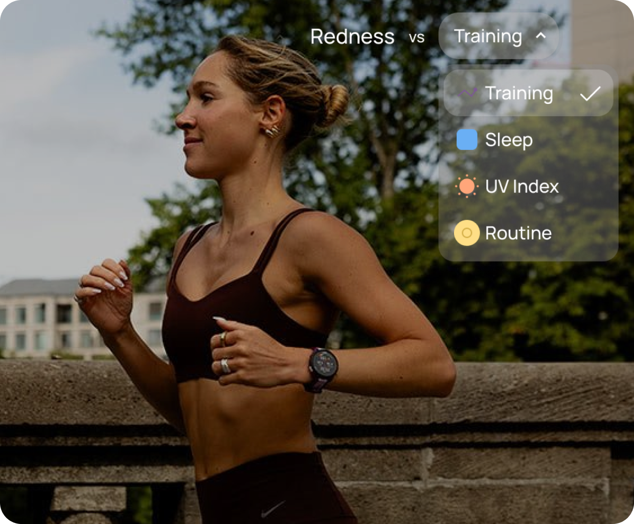 Athletic woman in activewear running outdoors wearing a Garmin watch.