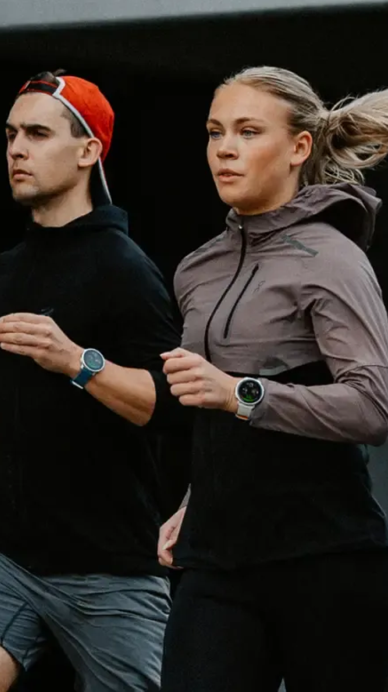Three runners wearing Polar smartwatches jogging outdoors, representing endurance training data integration with Stella.