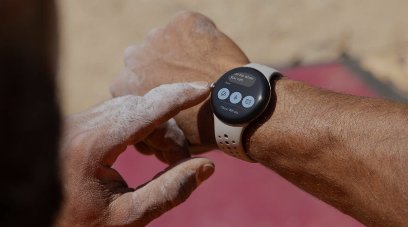 Woman wearing a Samsung Galaxy Watch smiling outdoors in a city